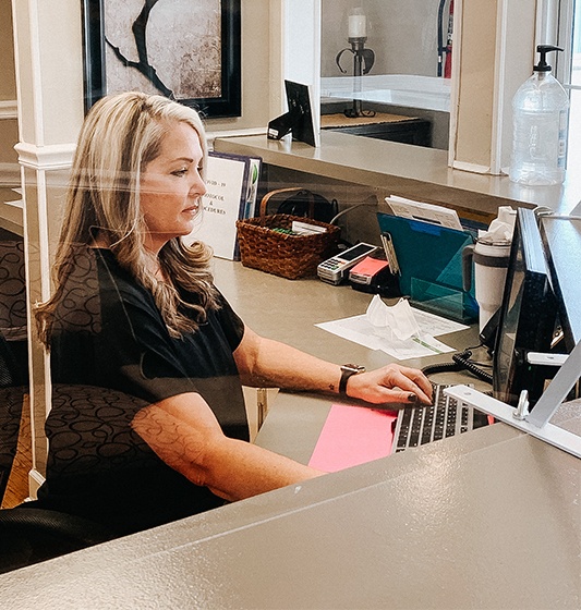 Dental team member reviewing dental insurance coverage