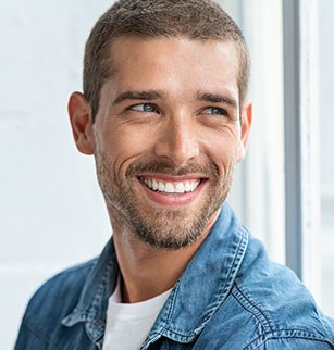 Man in blue shirt smiling