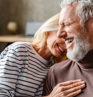 Happy senior couple laughing together