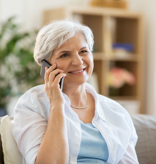 Woman discussing the cost of dental implant tooth replacement