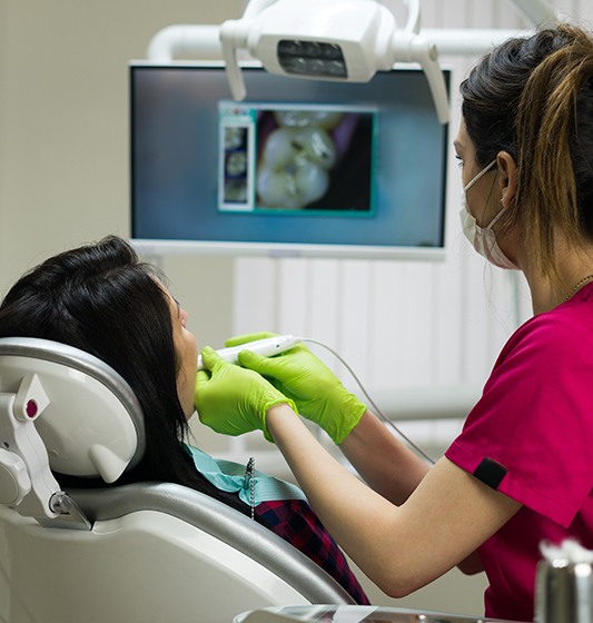 Dental team member using intraoral camera to capture smile photos